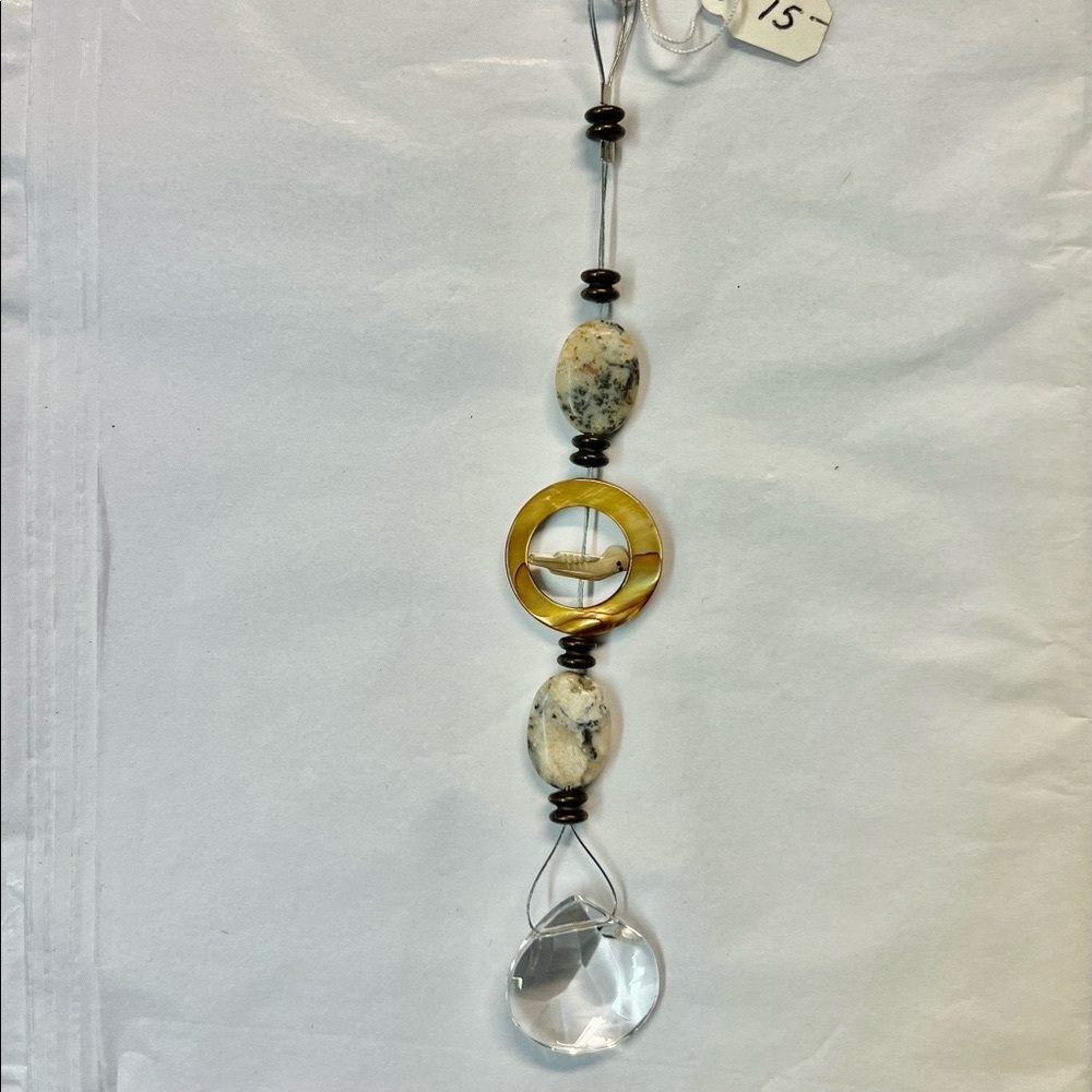 Sparkling crystal sun catcher with bird accent. Handcrafted.